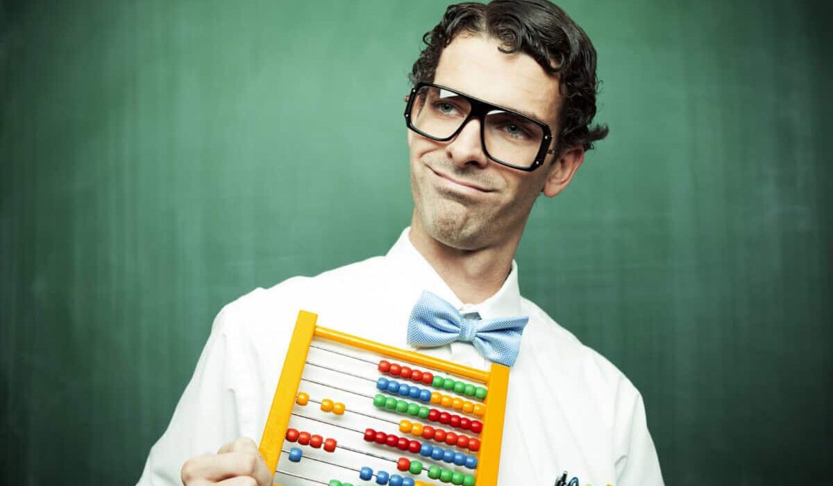 man in bowtie poses with abacus