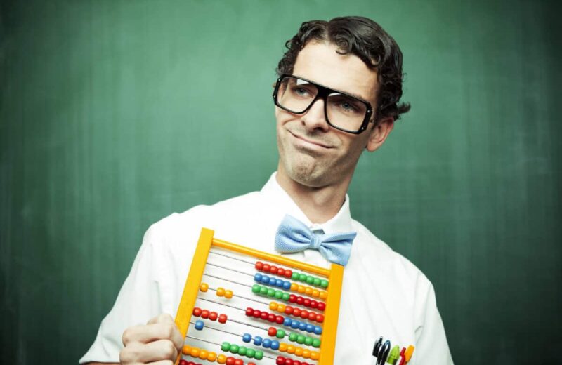man in bowtie poses with abacus