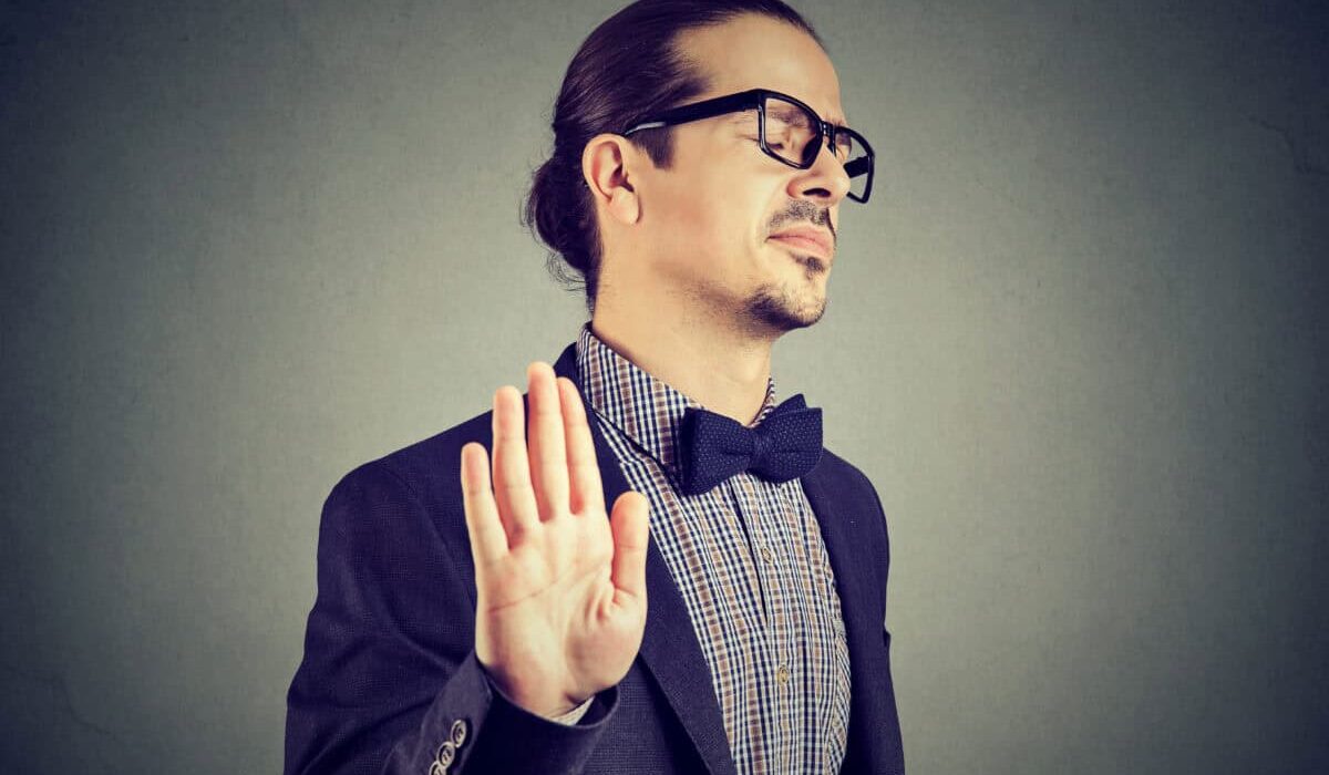 man gives stopping gesture