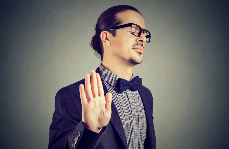 man gives stopping gesture